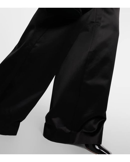 Pantaloni a gamba larga Teyana in raso di Khaite in Black