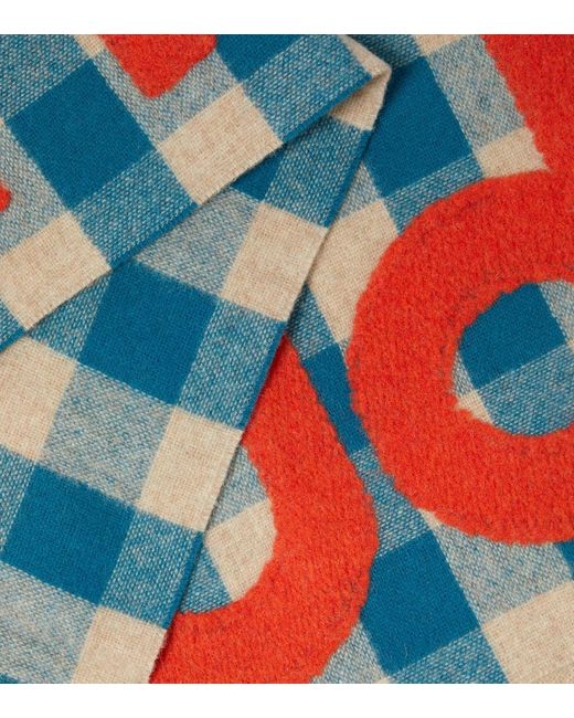 Sciarpa in misto lana a quadri con logo di Acne in Blue