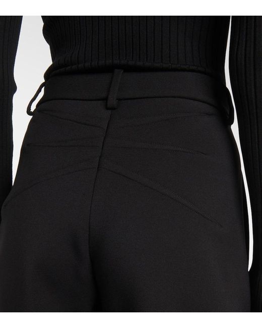 Pantalones barrel fit de lana Alaïa de color Black