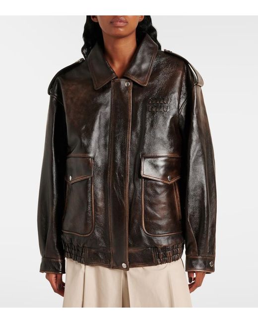 Veste En Cuir Et Shearling A Logo Miu Miu en coloris Black