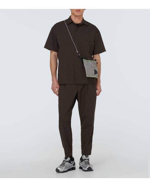 Pantaloni Regular di And Wander in Black da Uomo