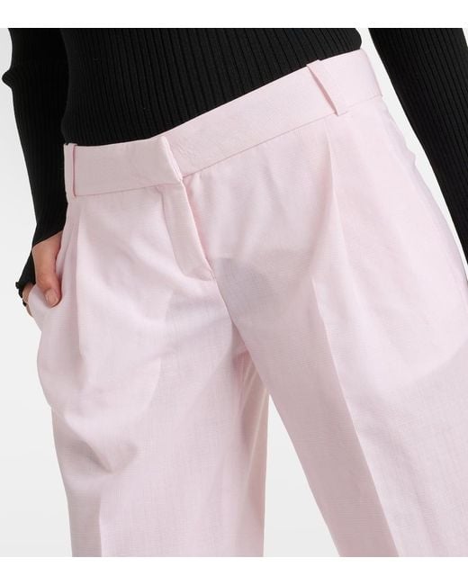 Pantaloni in lana a vita bassa di Coperni in Pink