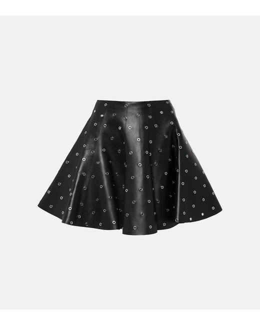 Minifalda de piel adornada con ojales Alaïa de color Black