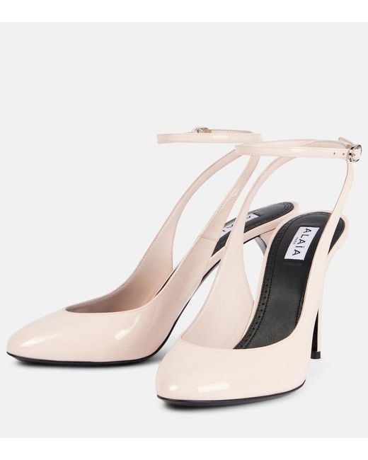 Alaïa White Patent Leather Slingback Pumps