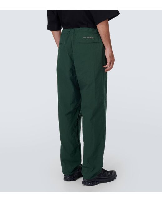 And Wander Green Nylon Chino Tuck Tapered Pants for men