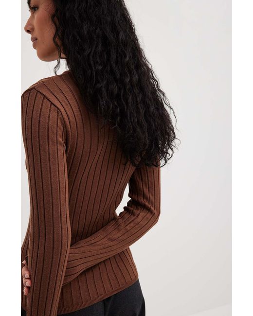 brown designer sweater