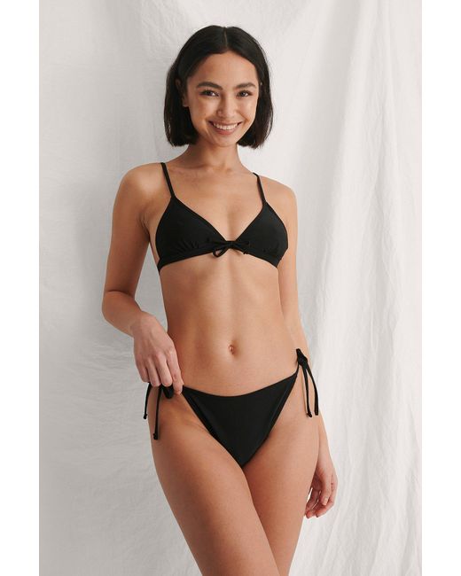NA-KD Synthetik Swimwear Recycelt Bikini-Unterteil mit Schnürdetail in  Schwarz - Sparen Sie 6% - Lyst