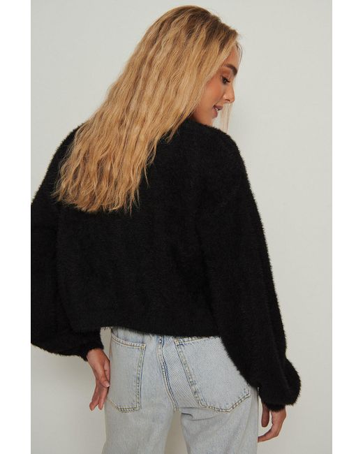 black fluffy cropped cardigan