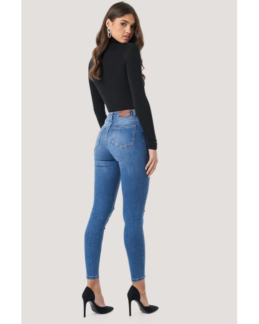 skinny mid waist destroyed jeans