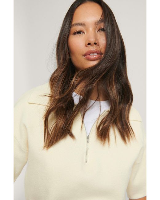 brown sweater with white collar