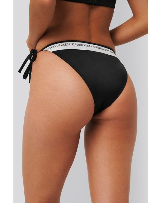 Calvin Klein Tie Side Bikini Bottom - Ck Logo in Black | Lyst