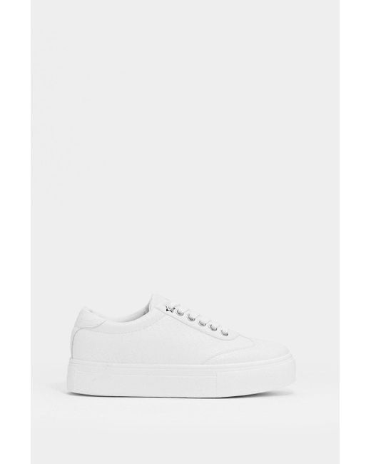 white faux leather platform sneakers