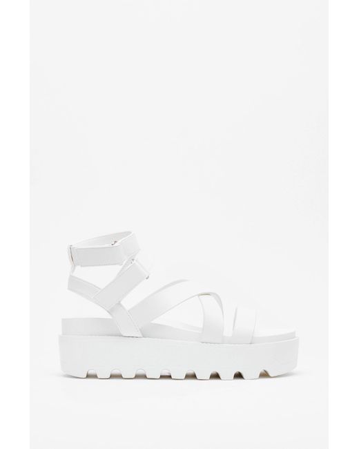 white cleated platform sandals