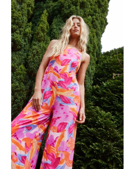 Nasty Gal Synthetic Bright Floral Open Back Wide Leg Jumpsuit In Hot