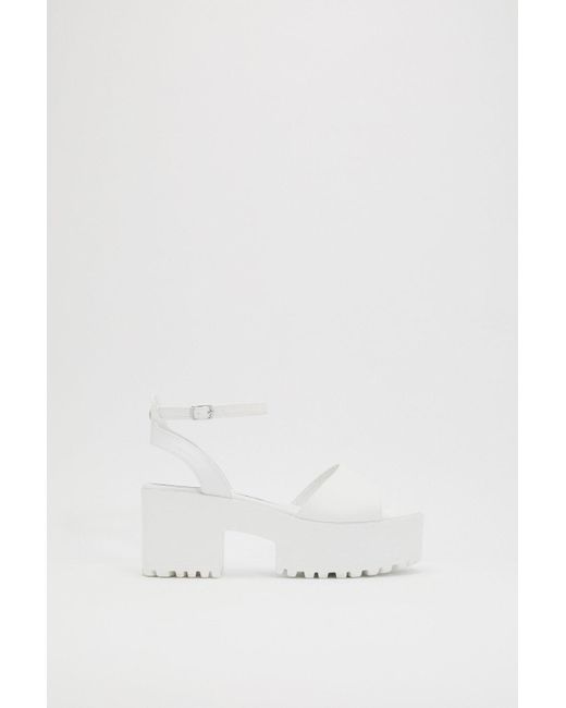 white cleated platform sandals