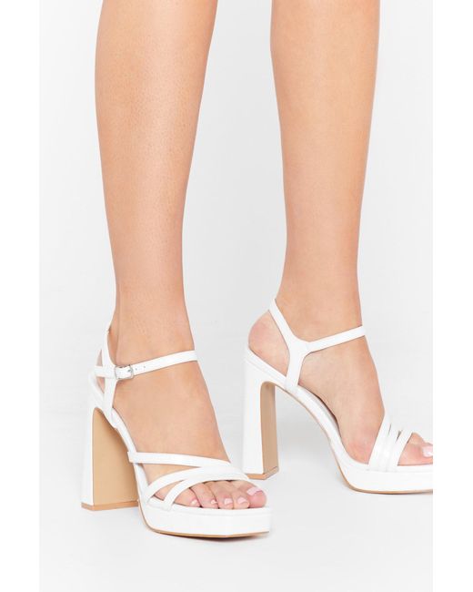 white strappy platform heels
