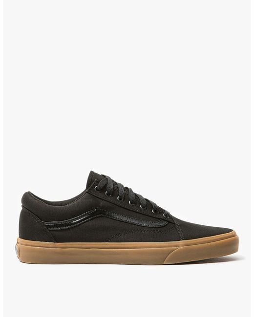 $55 - From Vans, the classic Old Skool shoe in Black. Featuring a canvas upper, padded collar, flat woven laces, metal eyelets, leather side stripe, canvas insole and signature rubber waffle outsole. Old Skool shoe in Black. Canvas upper. Padded collar. Flat woven laces. Metal eyelets. Leather side stripe. Canvas insole. Signature rubber waffle outsole. 1.25