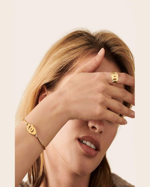 Dinh Van Metallic Yellow Gold Menottes R12 Flex Bracelet With Diamond Shoulders
