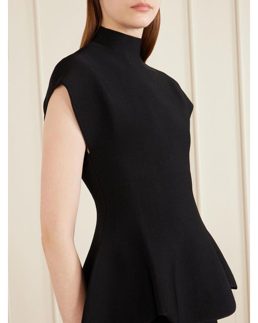 Khaite Black Andra Stretch-Knit Turtleneck Peplum Top