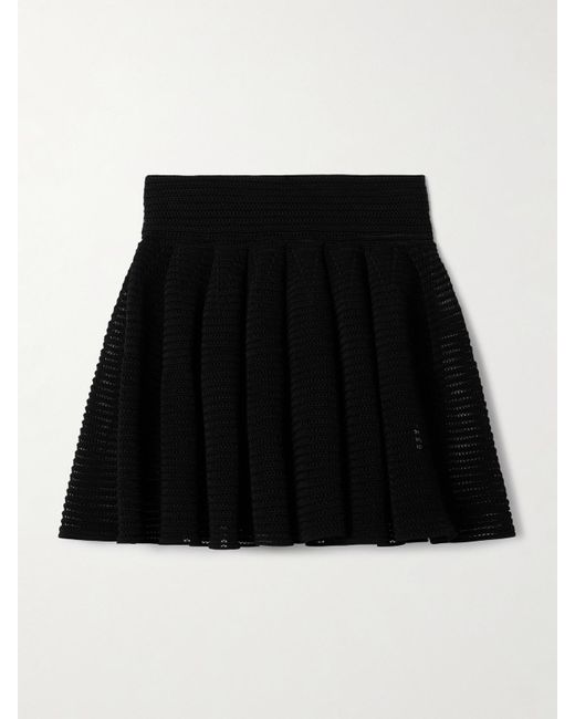 Mini-Jupe Plissée En Mailles Ajourées Alaïa en coloris Black