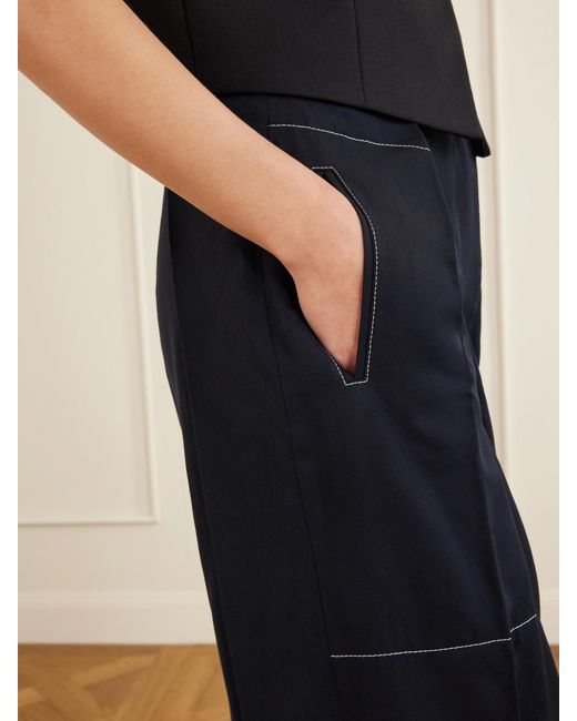 Sharon Wauchob Blue Arch Topstitched Paneled Pleated Wool-Twill Tapered Pants
