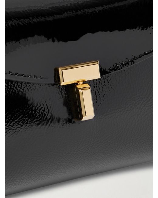 Totême Black T-Lock Mini Textured Patent-Leather Clutch