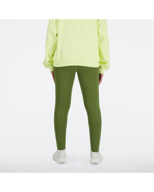 Nb sleek high rise sport legging 25" in verde di New Balance in Green