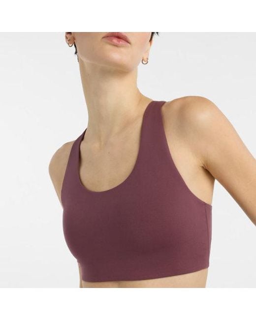 Donna Nb Define Train Bra, Maglia Di Poliestere, Taglia di New Balance in Red