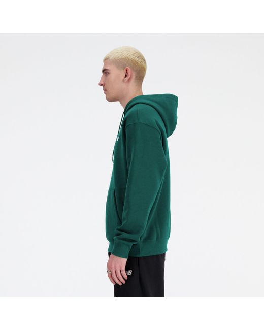 Sport essentials french terry hoodie in verde di New Balance in Green da Uomo