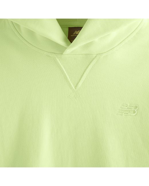Athletics french terry hoodie in verde di New Balance in Green
