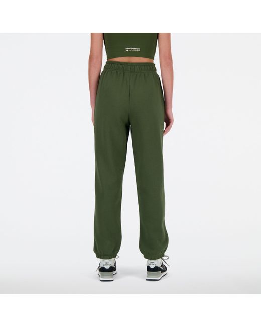 Linear heritage brushed back fleece sweatpant in verde di New Balance in Green