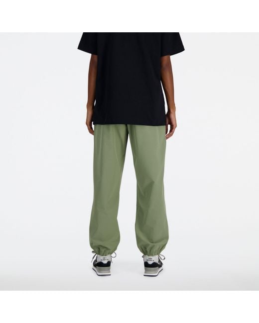 New Balance Black Athletics Stretch Woven jogger In Green Poly Knit