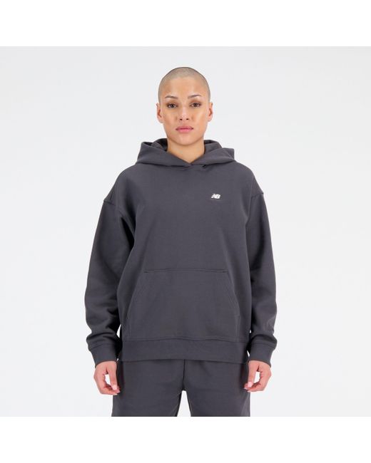 New Balance Blue Sport essentials premium fleece hoodie in schwarz
