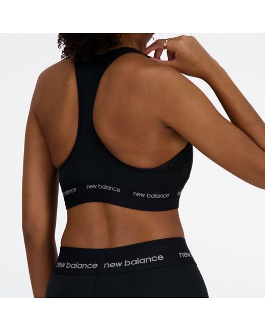 Nb sleek medium support sports bra in nero di New Balance in Black