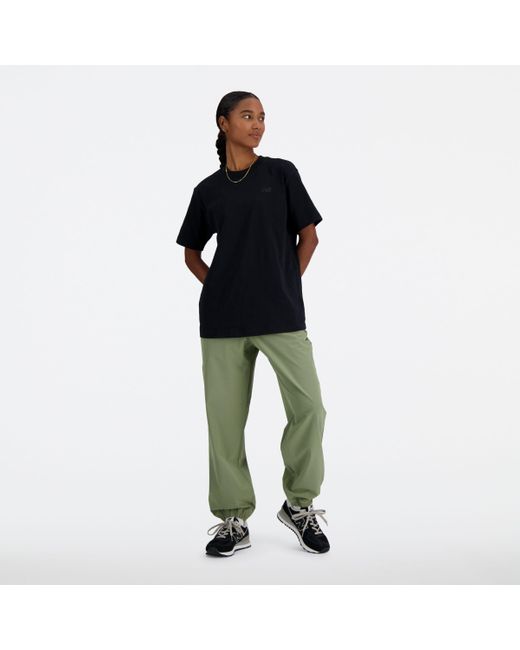 New Balance Black Athletics Stretch Woven jogger In Green Poly Knit