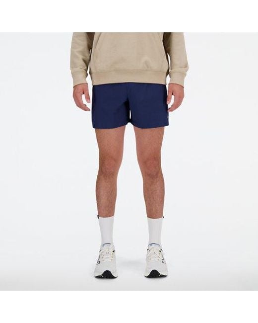 New Balance Blue 's Sports Essentials Shorts 5 Inch for men
