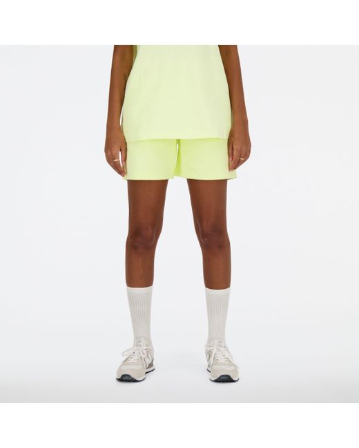 Athletics french terry short New Balance de color Yellow