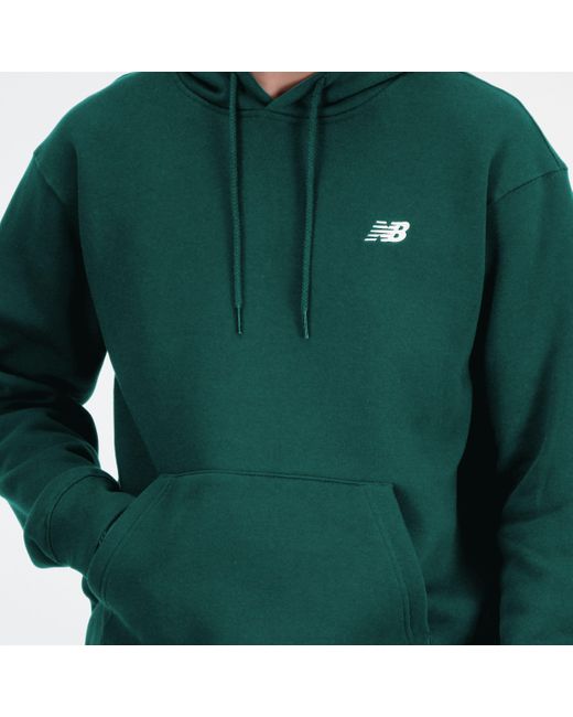 Sport essentials french terry hoodie in verde di New Balance in Green da Uomo