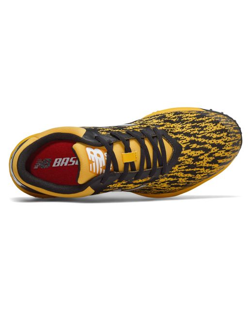 new balance black and yellow turf shoes