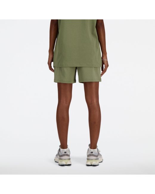 Athletics french terry short in verde di New Balance in Green