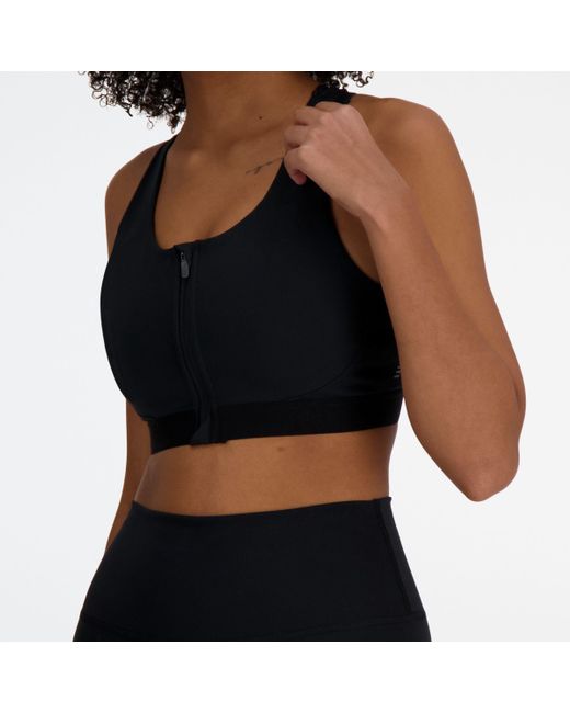 New Balance Black Nb sleek medium support pocket zip front bra in schwarz
