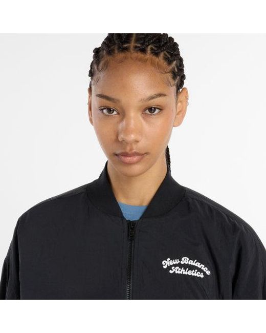 Donna Linear Heritage Woven Bomber Jacket di New Balance in Black