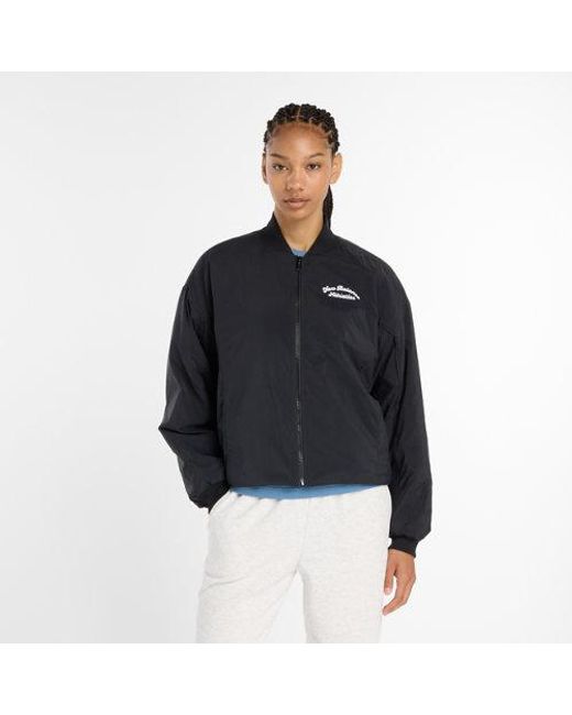 Donna Linear Heritage Woven Bomber Jacket di New Balance in Black