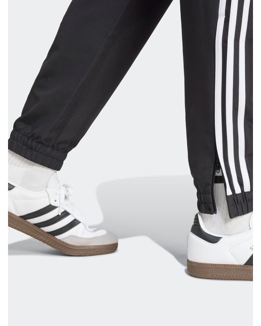 Adidas Black Tiro 25 Essentials Woven Tracksuit Joggers for men