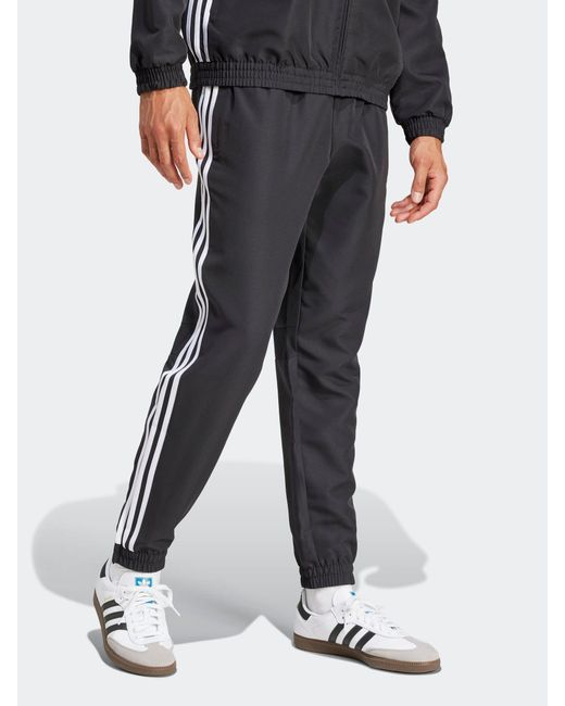 Adidas Black Tiro 25 Essentials Woven Tracksuit Joggers for men