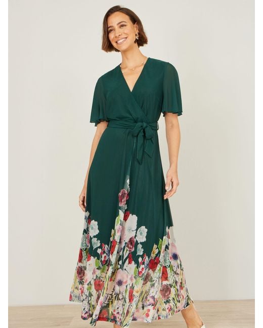 Yumi' Mesh Wrap Midi Dress With Floral Hem Border in Green | Lyst