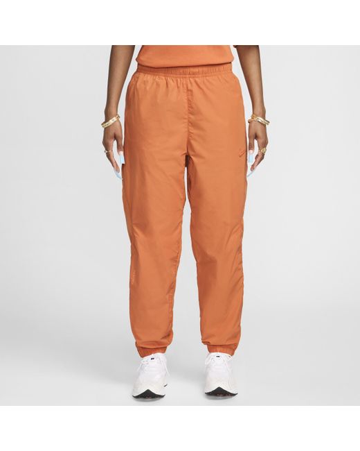 Nike Nocta Northstar Nylon Trainingsbroek in het Oranje voor heren Lyst NL