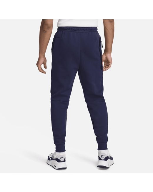 Pantaloni jogger da calcio inghilterra tech fleece di Nike in Blue da Uomo