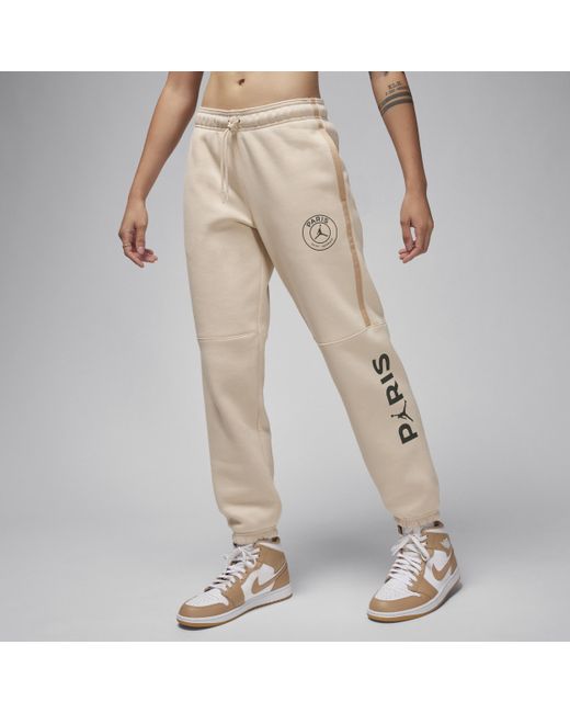 Pantaloni da calcio con grafica jordan paris saint-germain brooklyn fleece di Nike in Natural