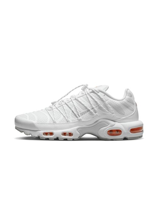 white nike trainers orange tick